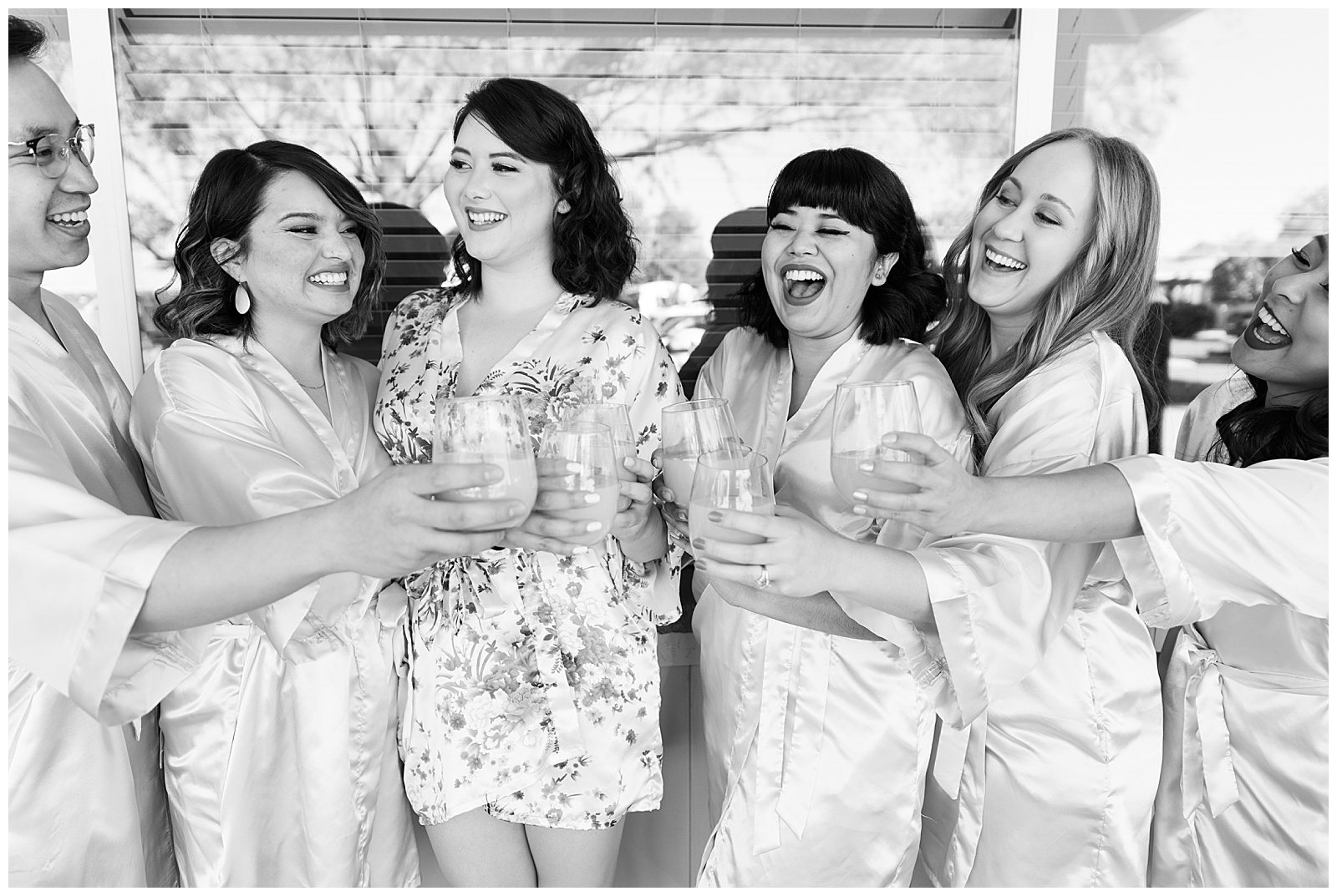 Bride and her bridesmaids sharing a toast at a Phoenix wedding.