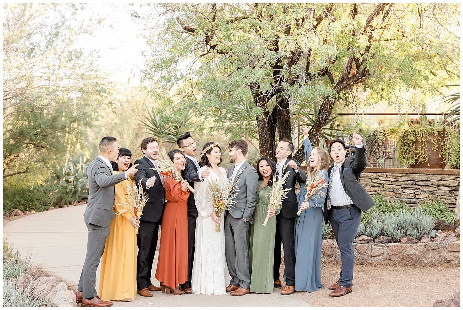 Bridal party cheers for Arizona wedding photographers.