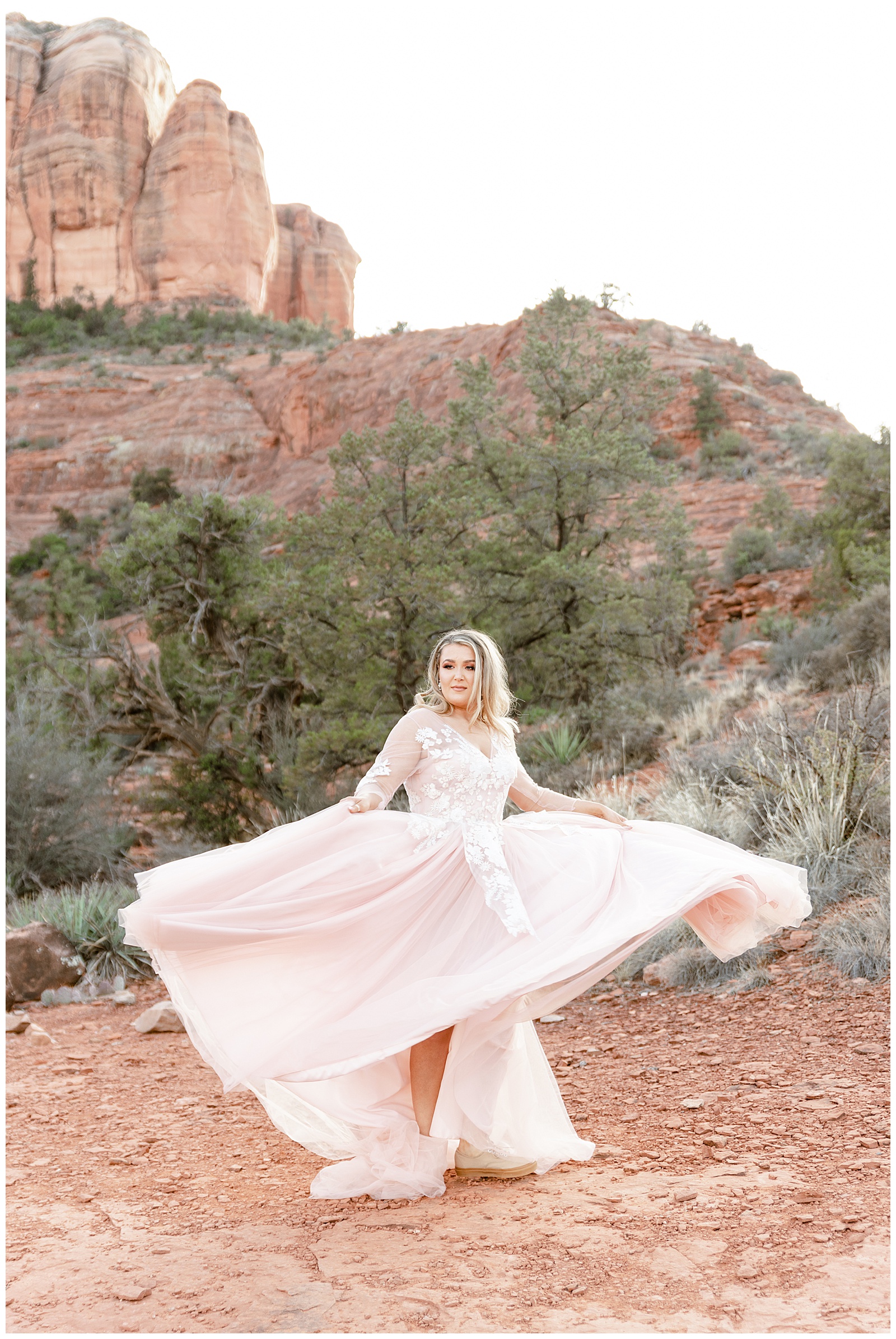 Blush colored wedding dress flows in the wind for an elopement bride