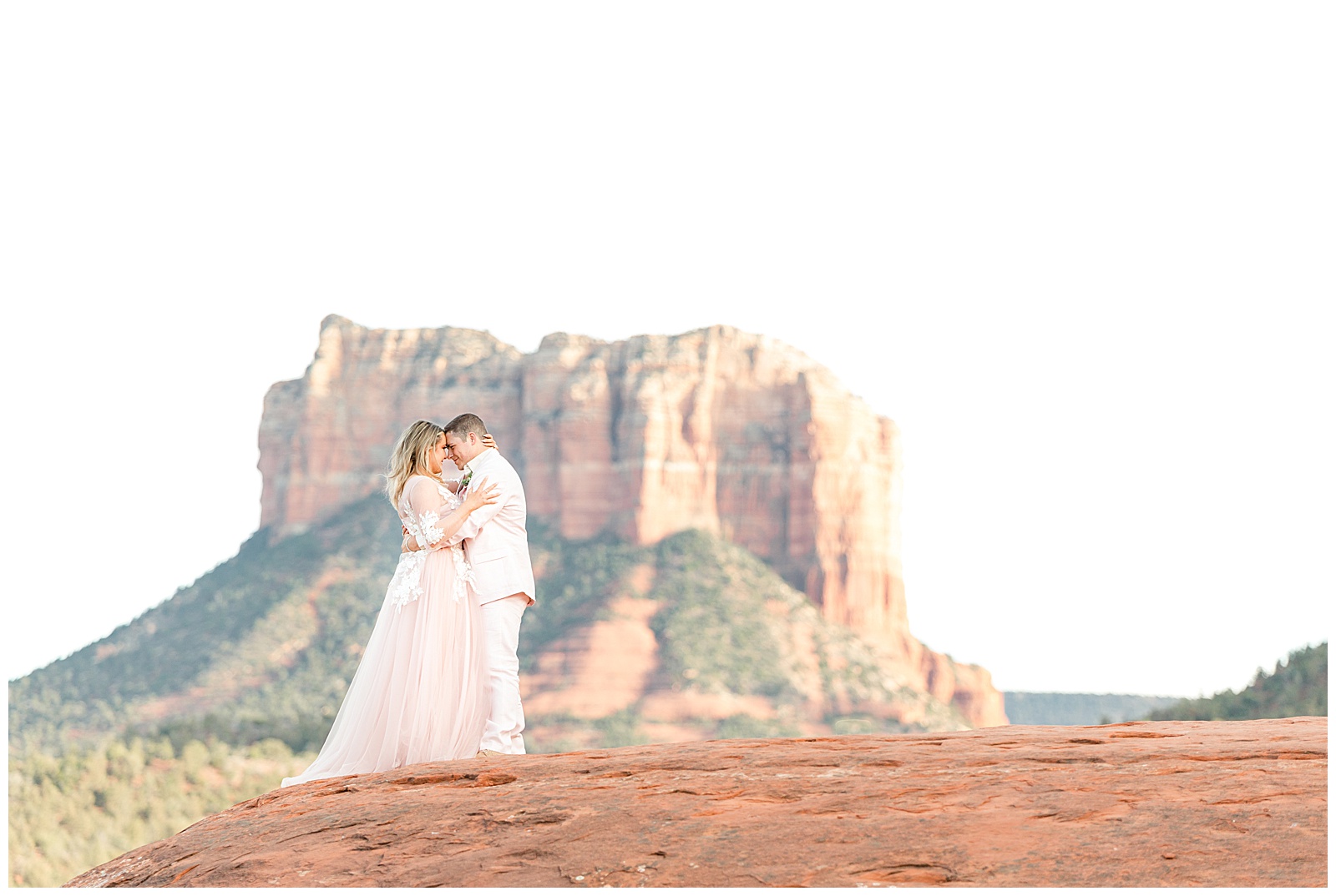 Courthouse Rock in the background as a bride and groom hold each other
