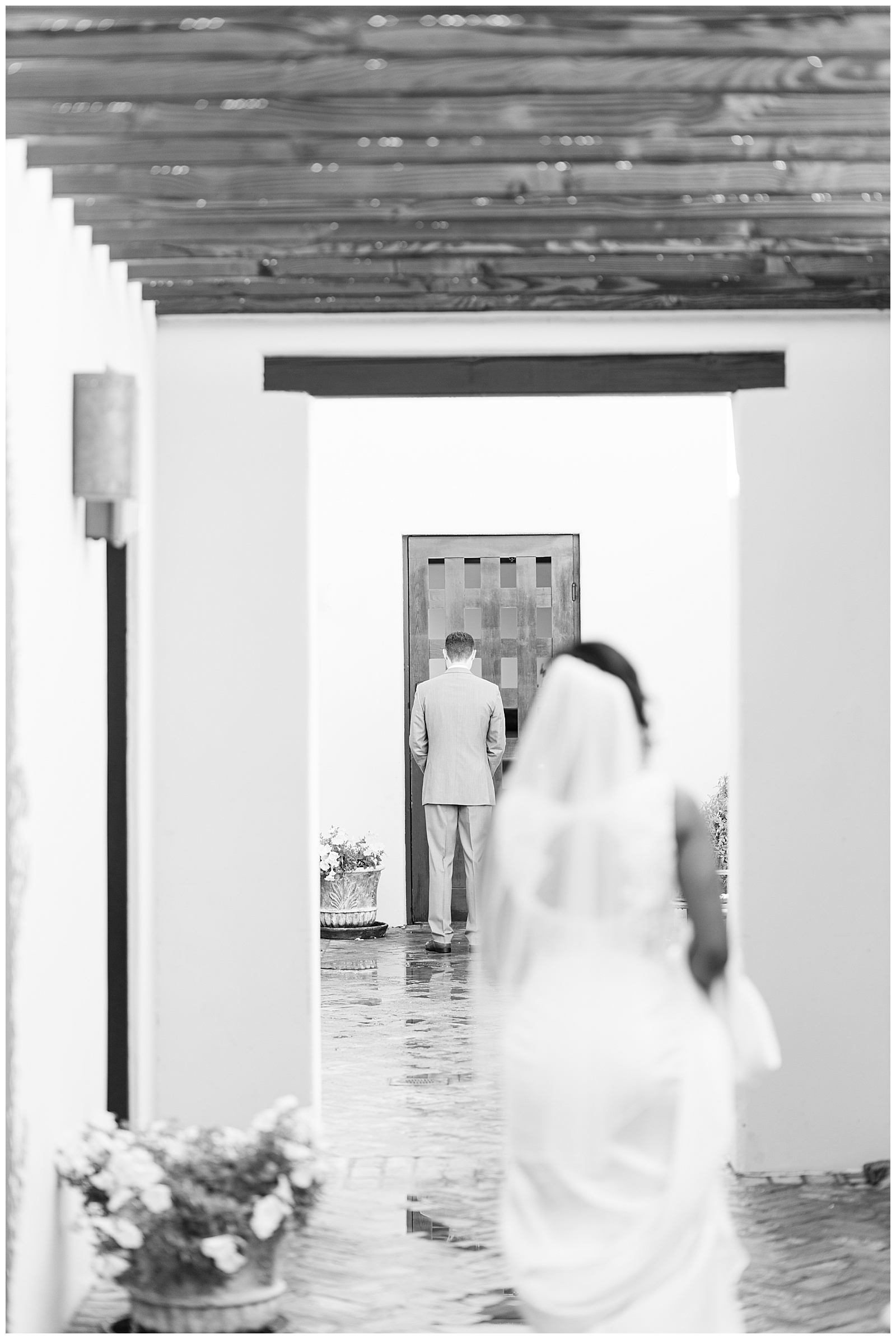 Bride walks to groom during wedding first look 