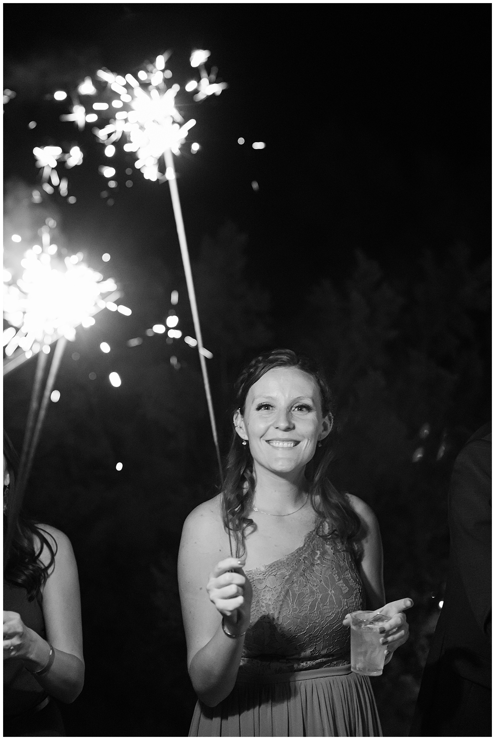 Desert Foothills Wedding Phoenix wedding photographer captures bridesmaid holding sparkler.