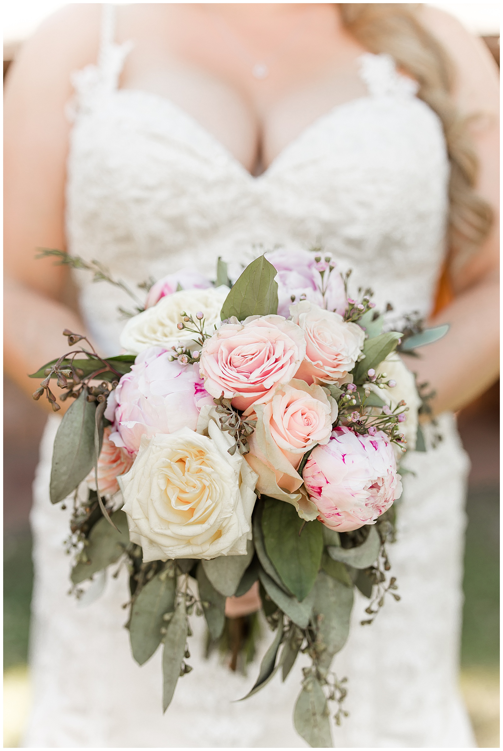 Bride holding bouquet at her intimate wedding