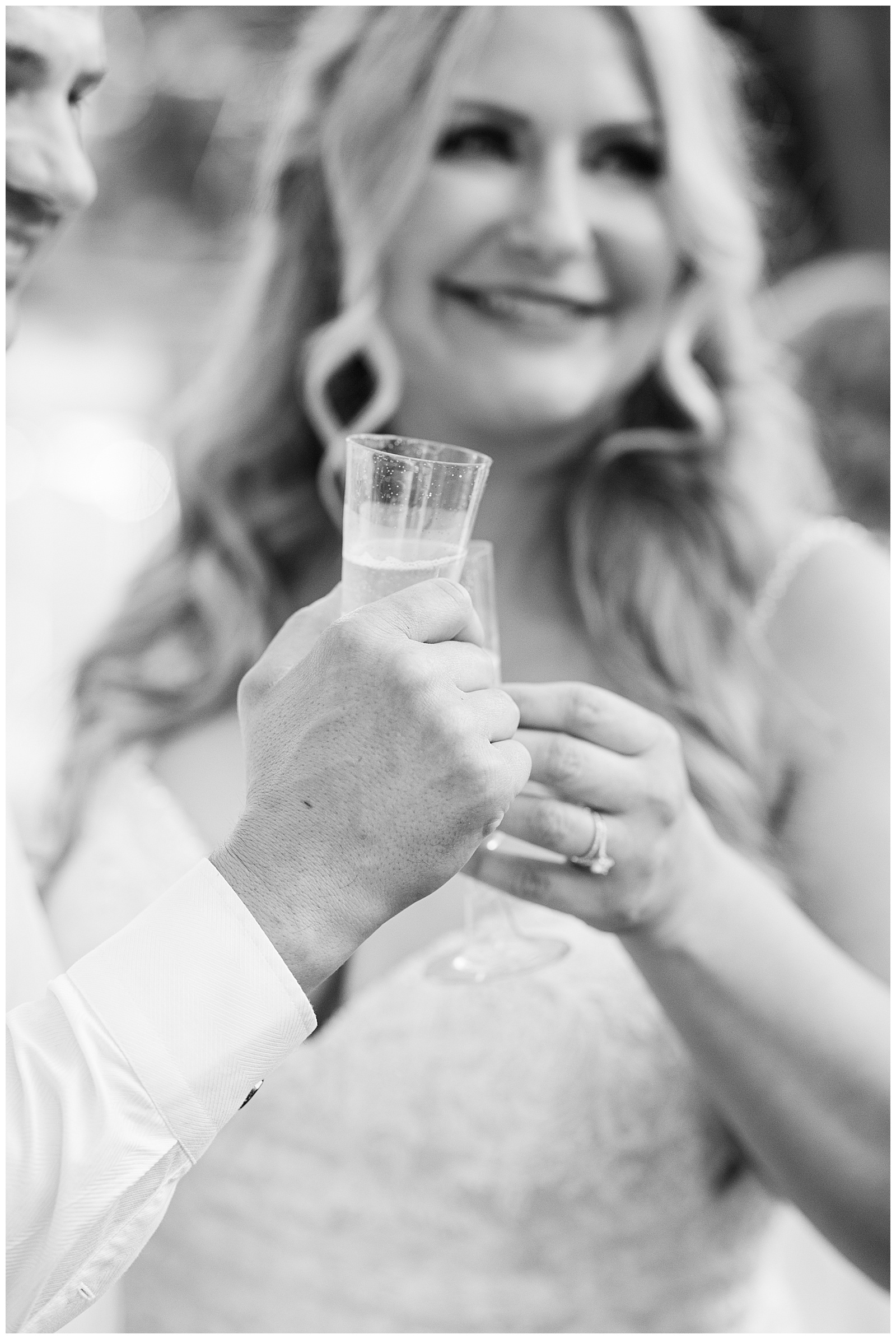 Bride and groom toast at their intimate wedding